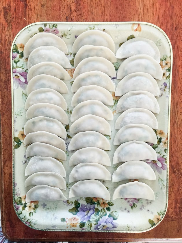 Moon shaped uncooked dumplings.