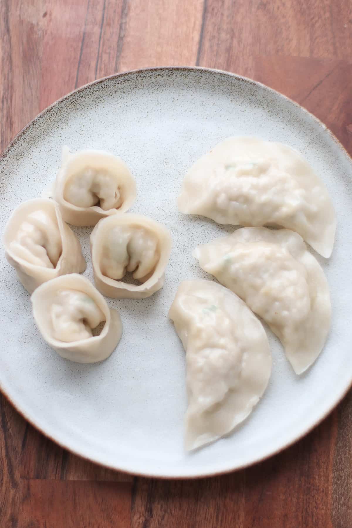 Steamed dumplings on a plate.