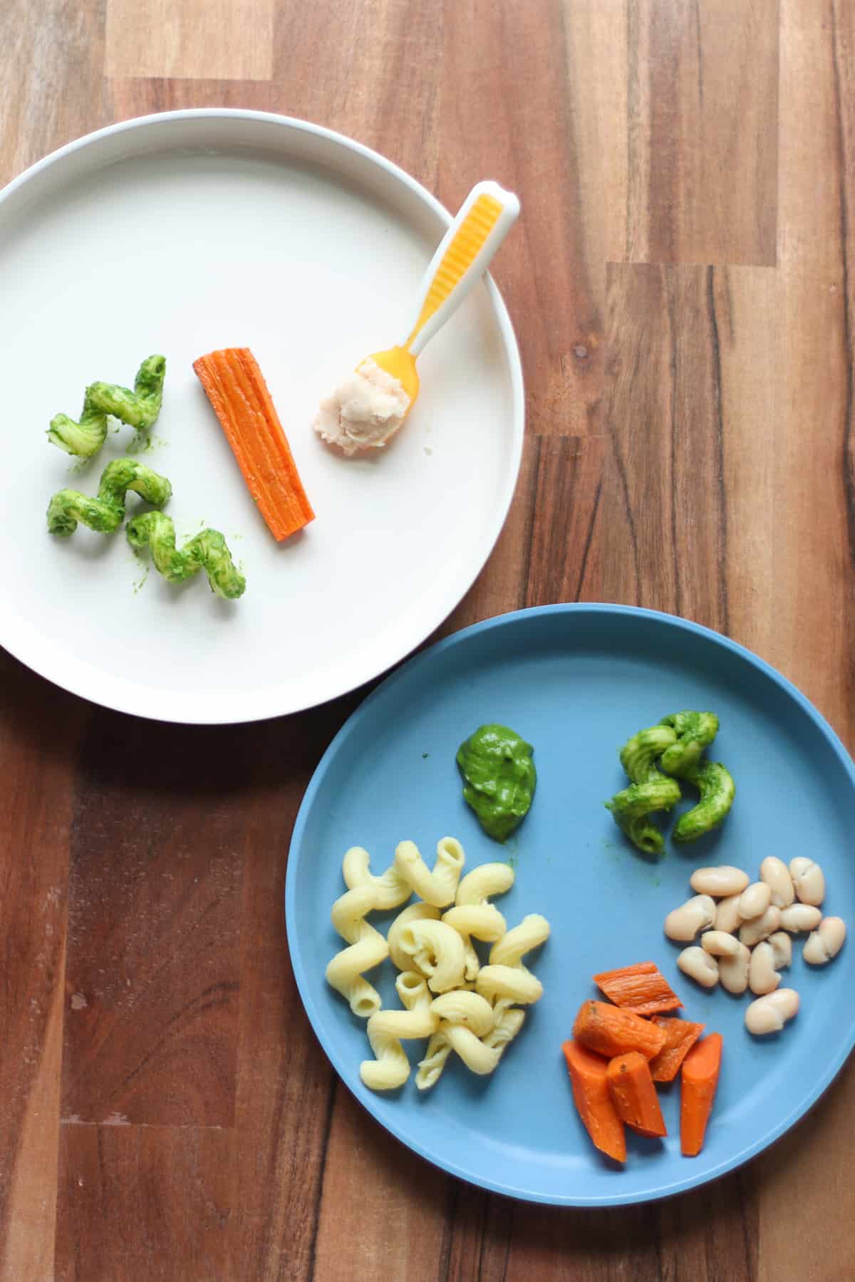 Green pasta served two ways - for toddler and baby.