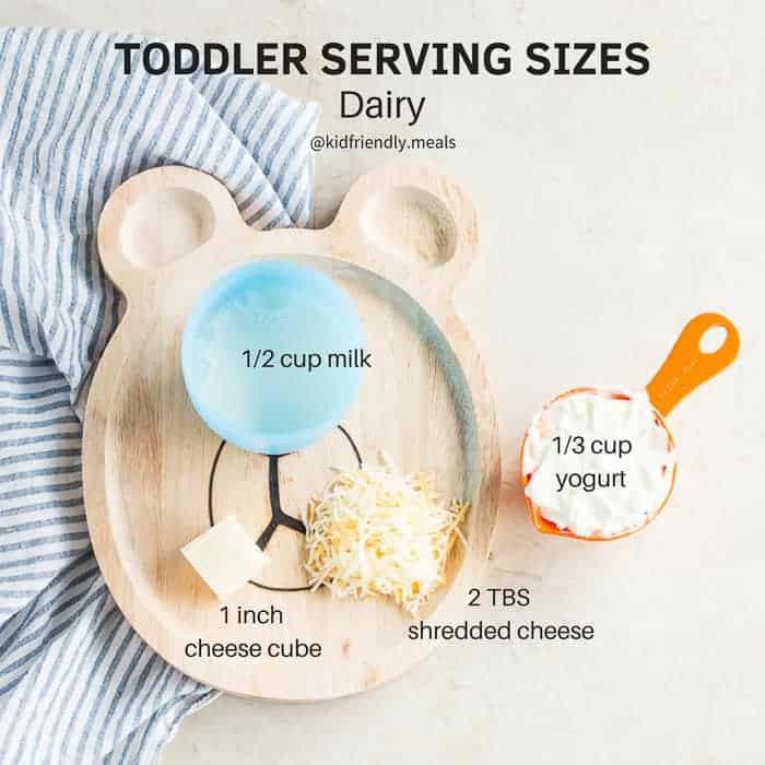 bear wooden plate with examples of what a serving size for different dairy foods look like