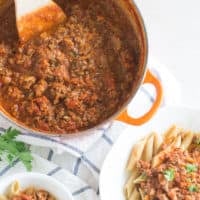 a close up shot of veggie loaded meat sauce
