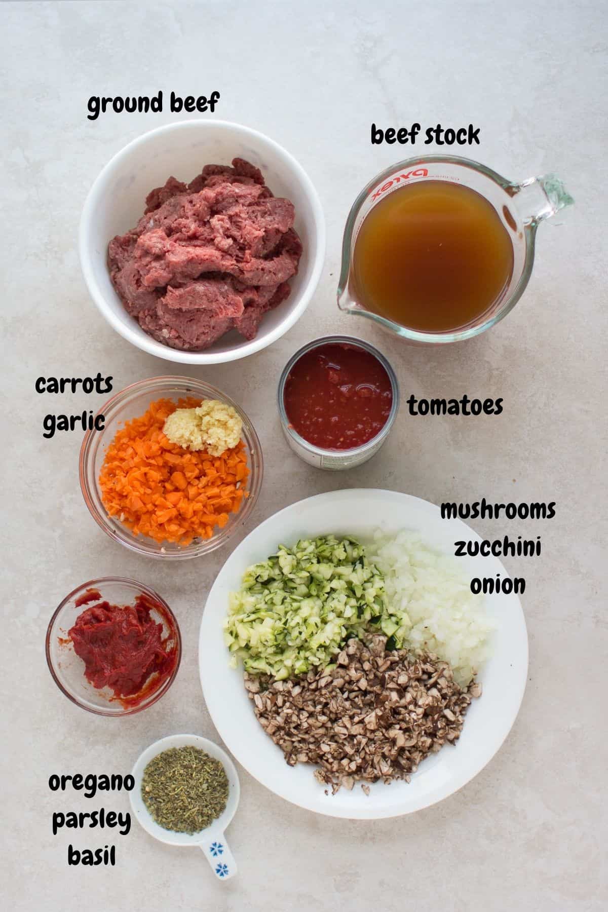 All the ingredients laid out on a white backgroound.