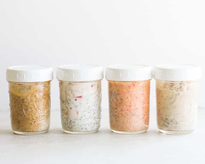 4 different overnight oats in individual mason jars