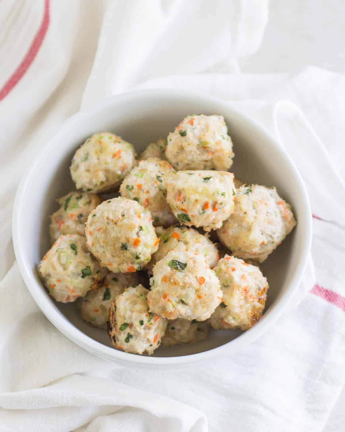 baked turkey rice meatballs in a deep white bowl