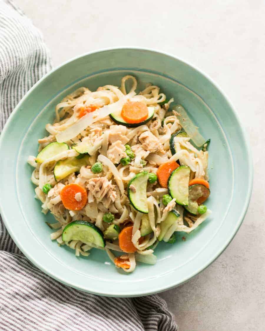 Pasta Stir-Fry with carrots and zucchini on a blue bowl