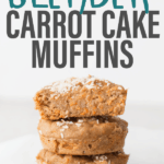 a closed up shot of three carrot oatmeal muffins stacked