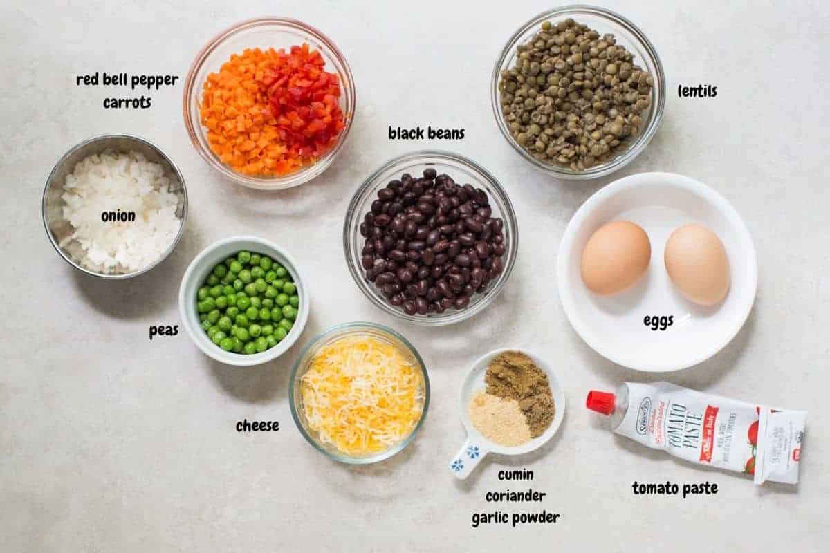 all the ingredients for the lentil muffins laid out on a white background