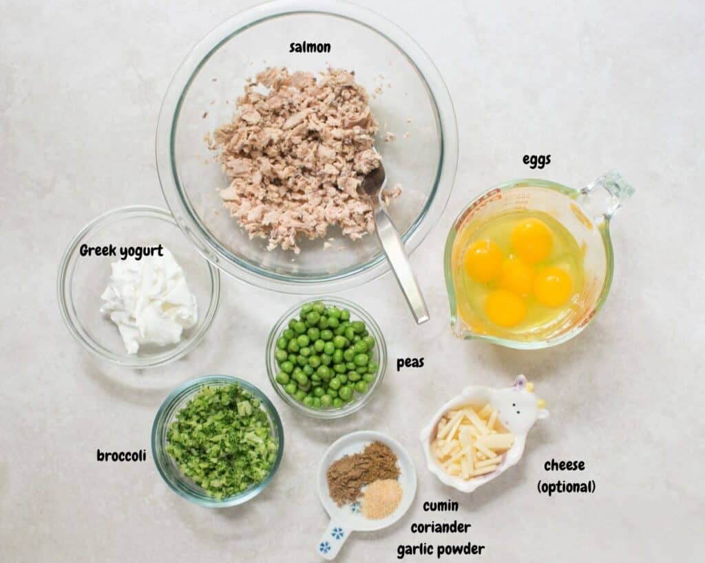 all the ingredients for the quiche on a white background