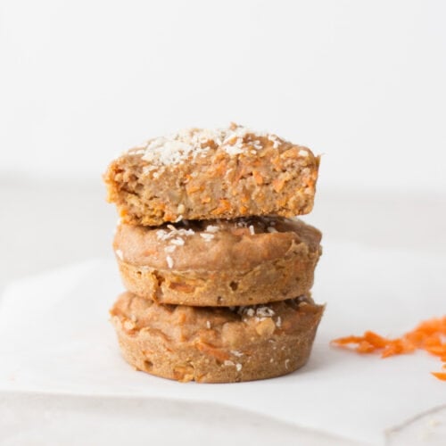 Three carrot muffins stacked.