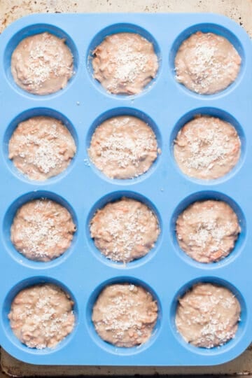 Muffin batter transferred to blue muffin pan.