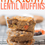 a close up shot of three stacked lentil muffins with the top one sliced in half