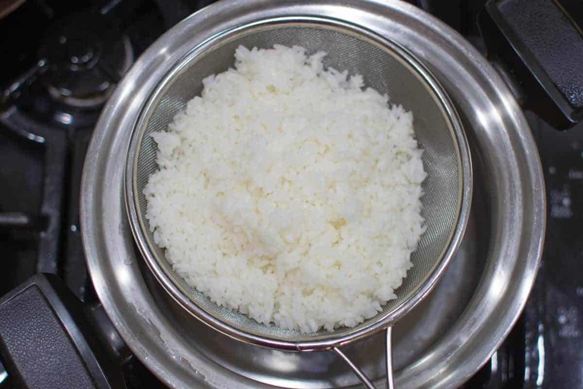 parboiled and strained rice placed in a colander