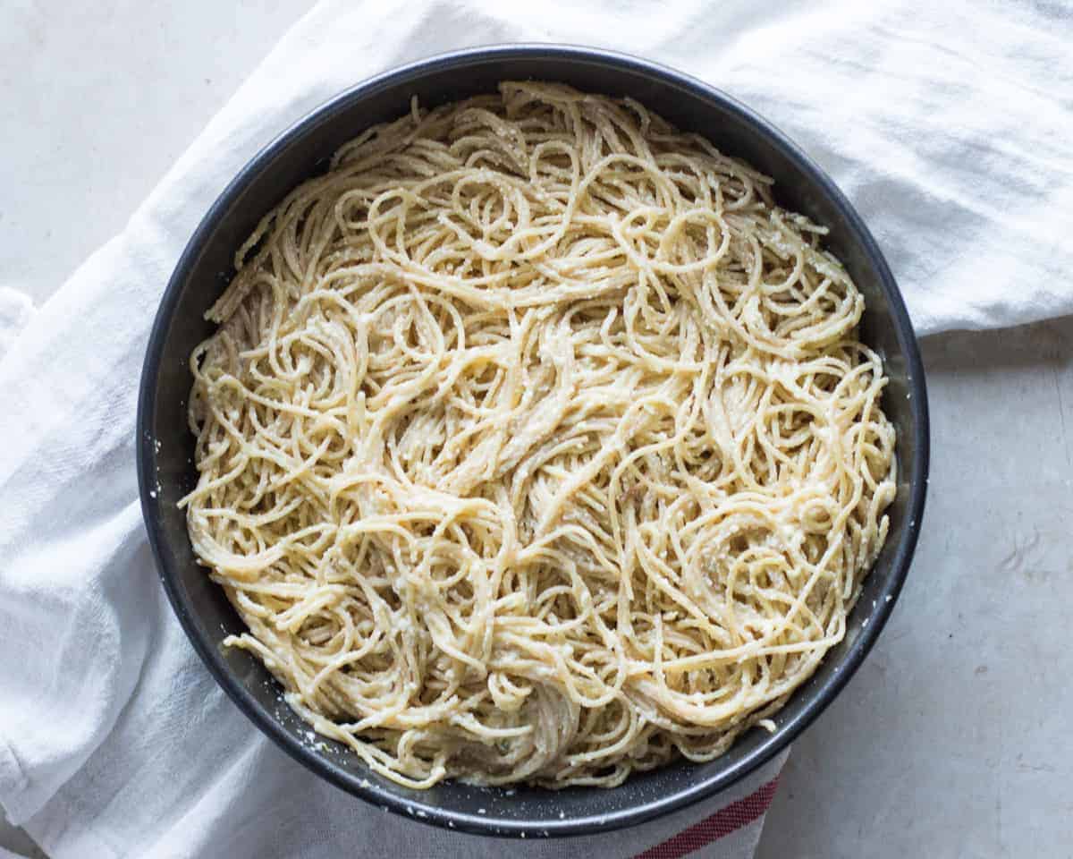 cooked pasta tossed with ricotta mixture and pressed into a round cake pan