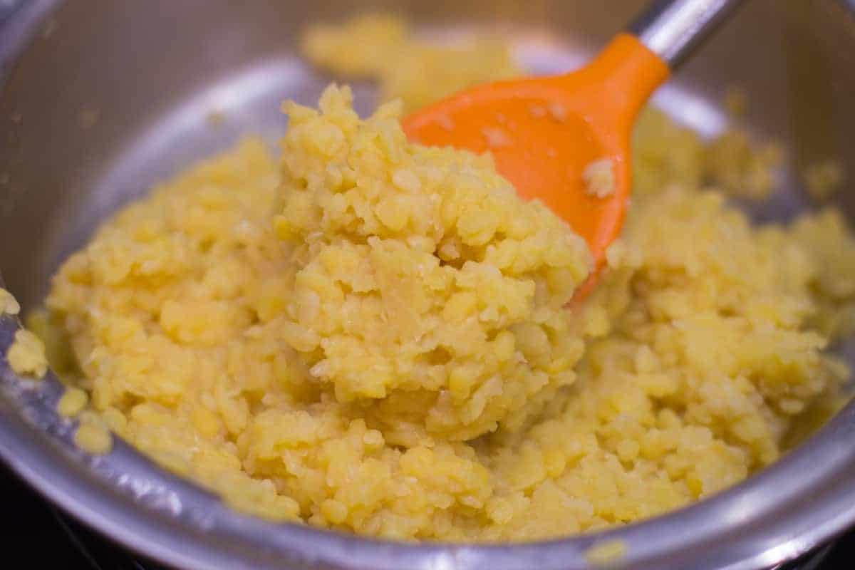 a close up shot showing the texture of yellow lentils
