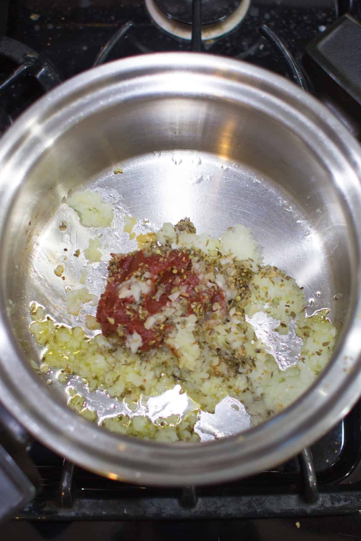 Sauteed onion with tomato paste.