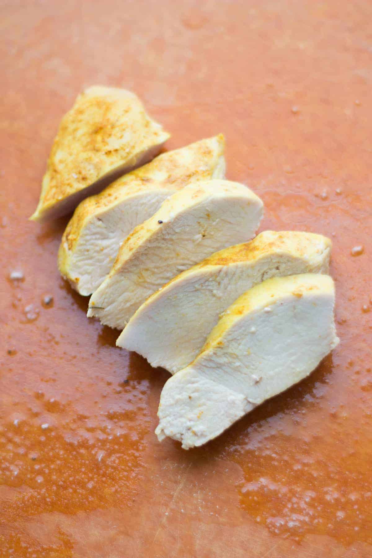 a close up shot of sliced steam roasted chicken