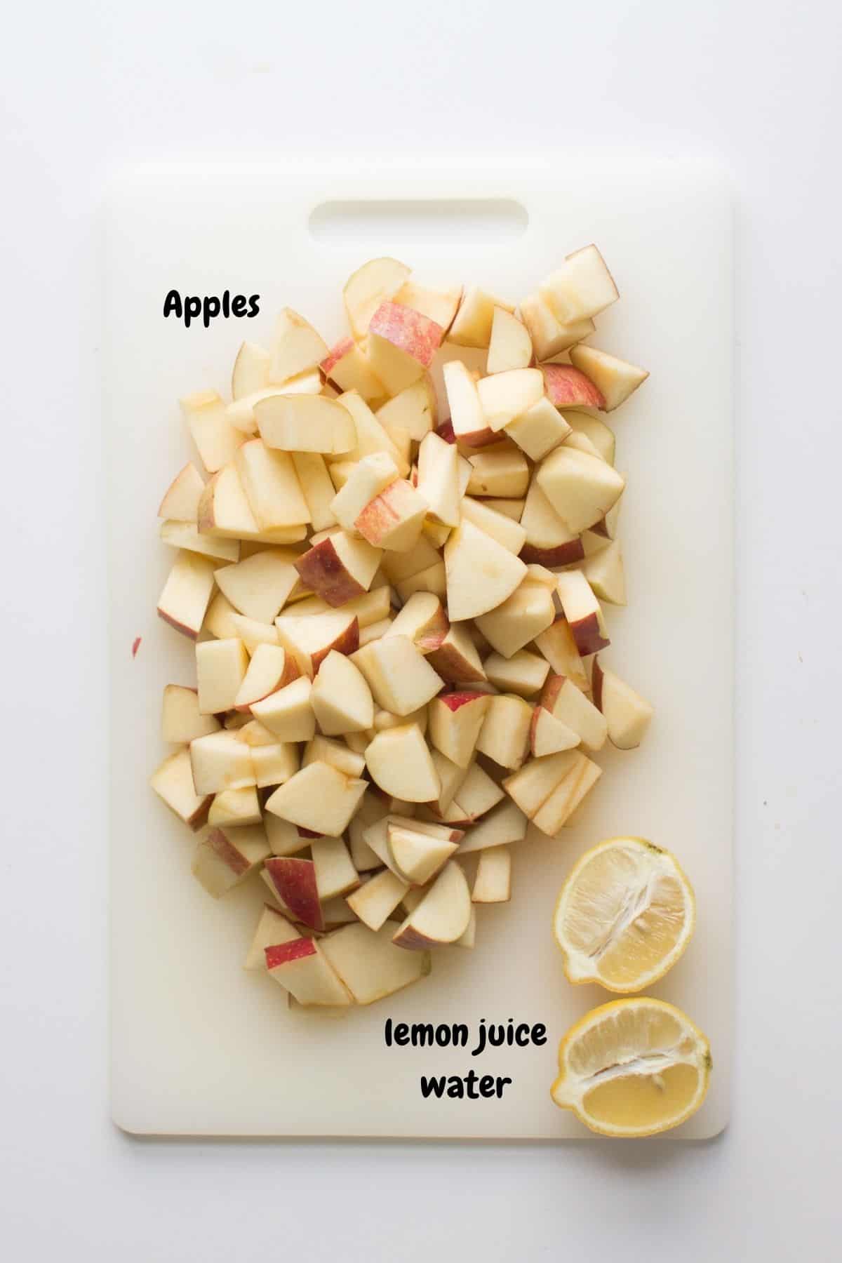 Chopped apples with sliced lemon.