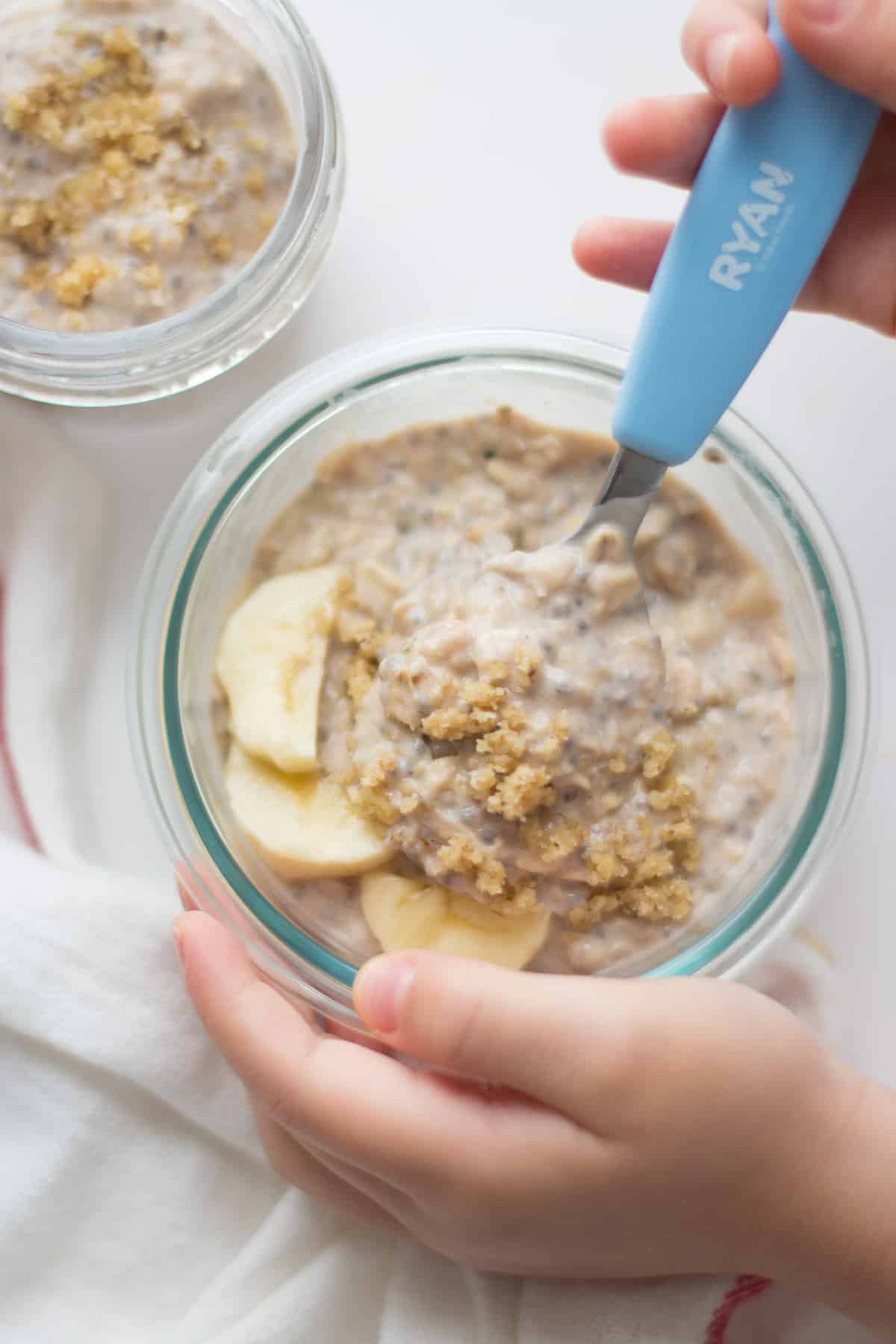 overnight oats with sliced banana, ground walnuts in a bowl.
