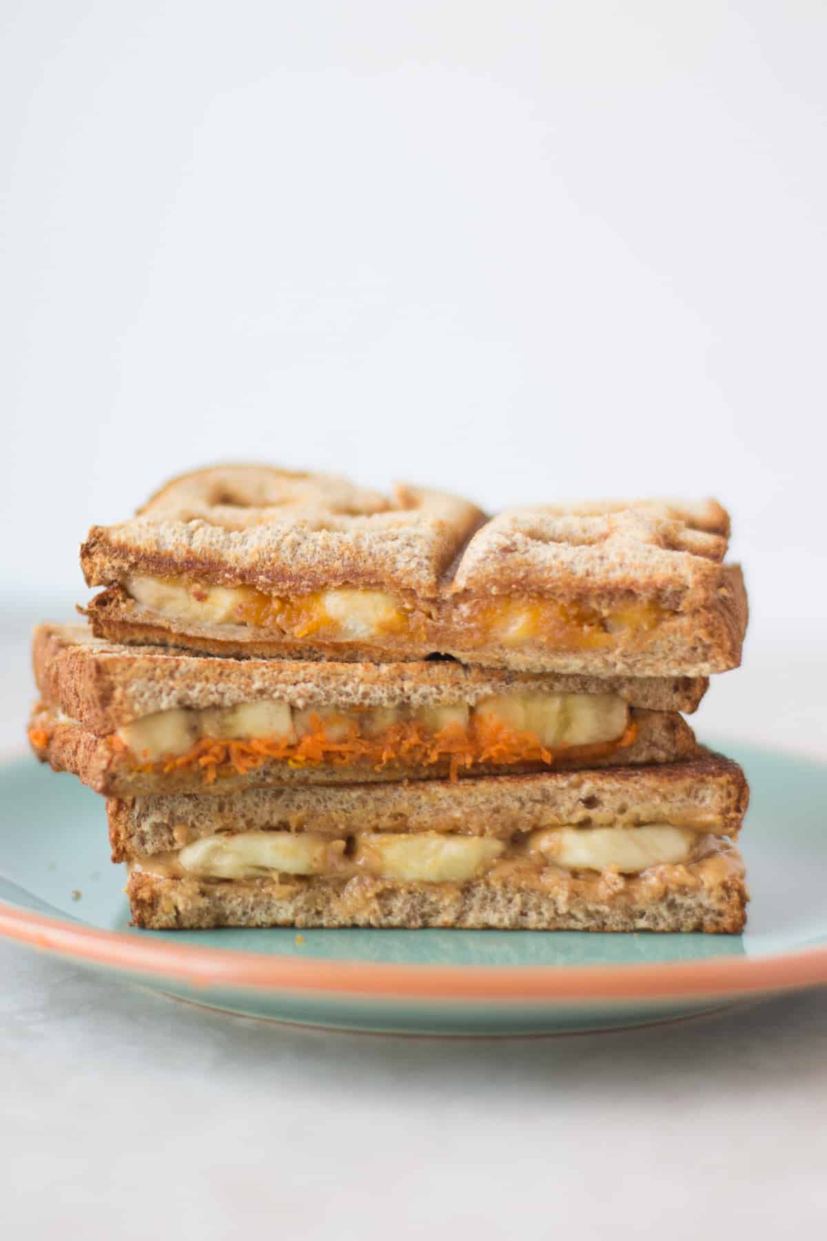 three variations of peanut butter sandwich stacked.