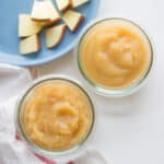 smooth and chunky applesauce in glass bowls.