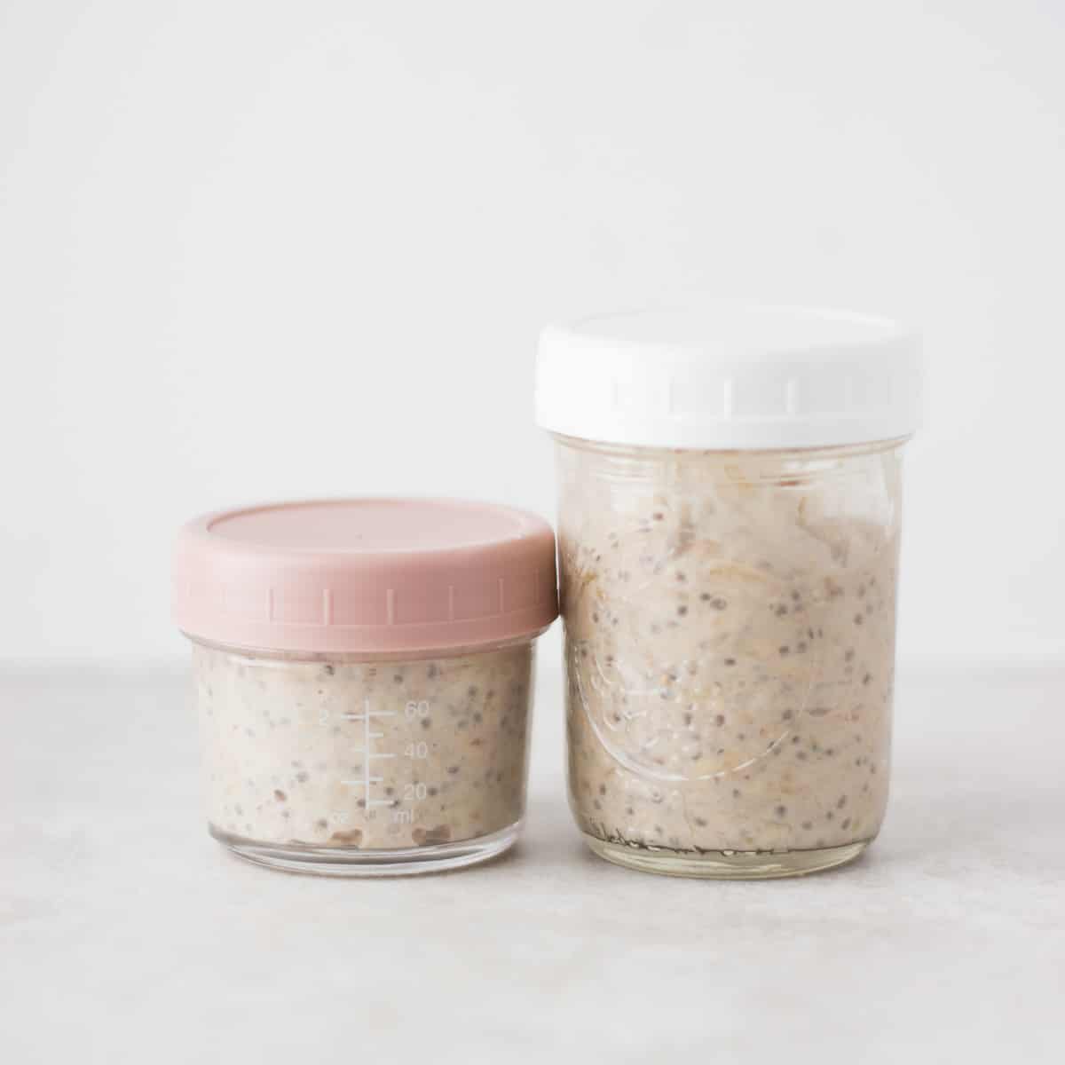 Two glass containers with overnight oats.