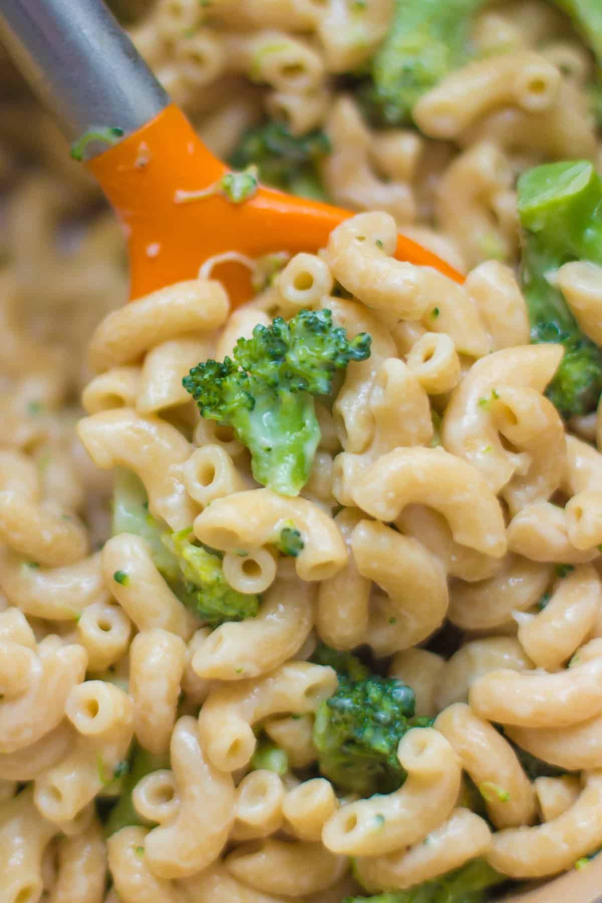 A close up shot of scooped broccoli pasta.