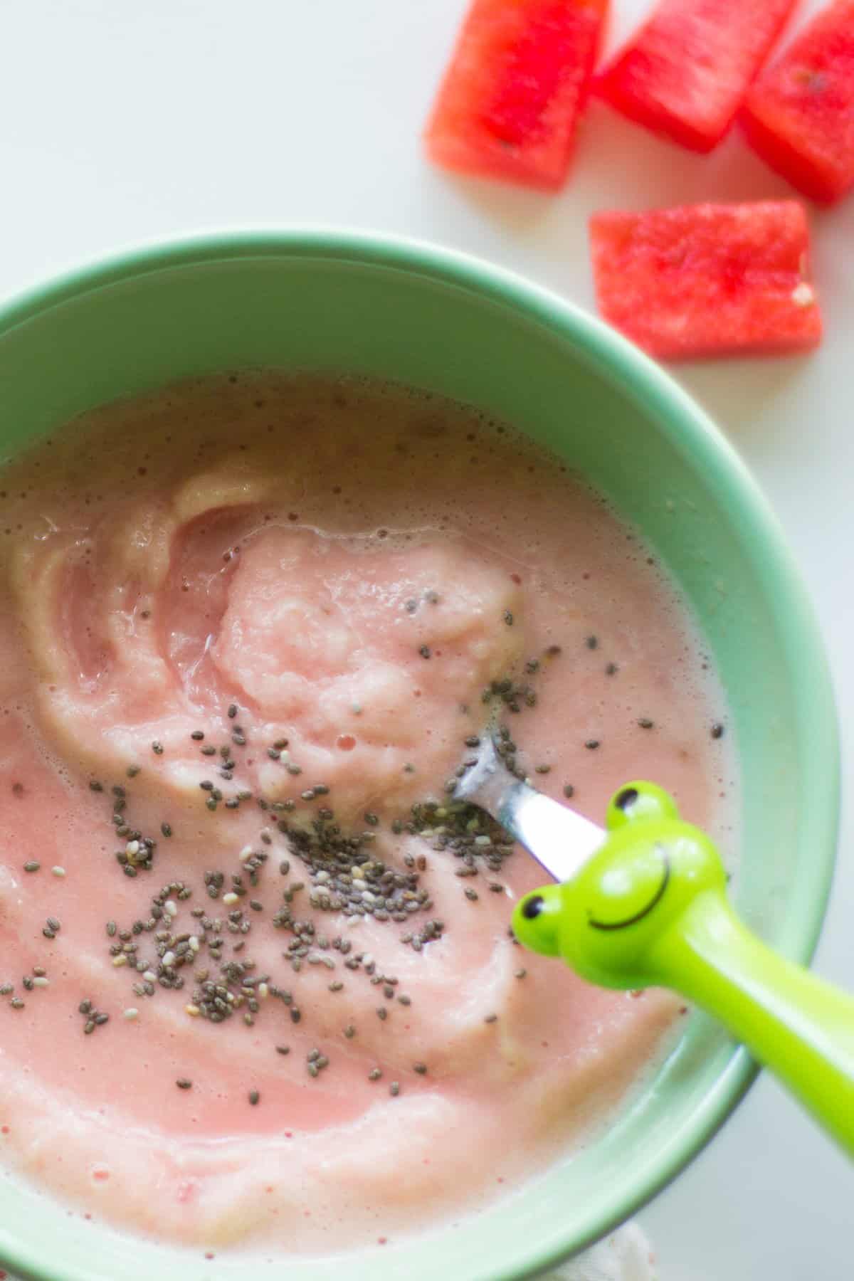 Thick smoothie served in a bowl with chia seeds.