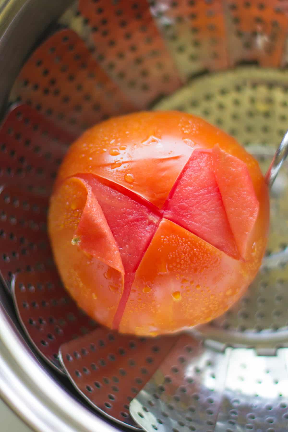Steamed beefsteak tomato with "x" mark.