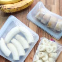 Sliced, halved, and mashed frozen bananas in freezer-safe bags.