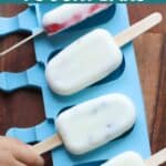 Four frozen yogurt bars placed on top of blue popsicle mold.