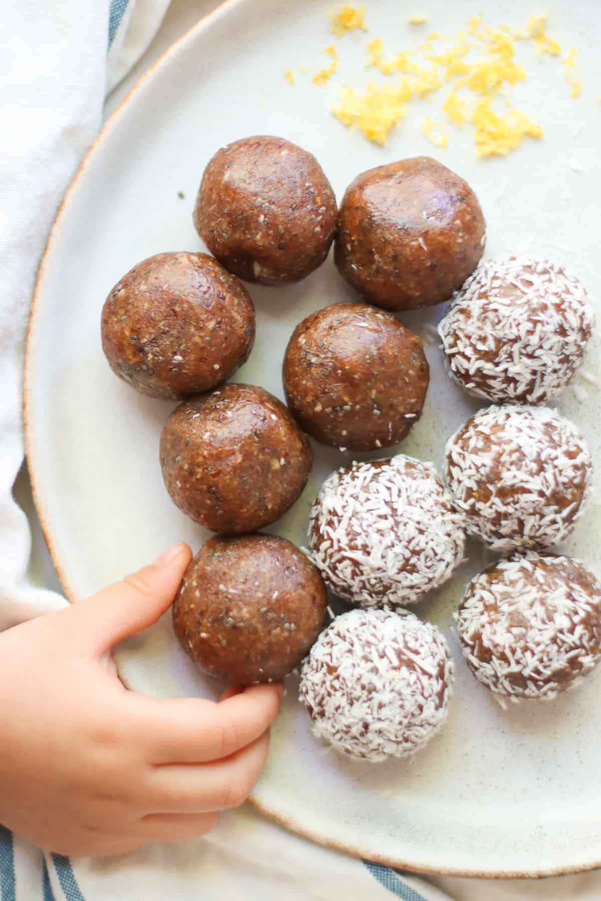 Half of bliss balls rolled in coconut and half without.