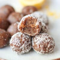 Stacked bliss balls with a bite taken out of one on the top.