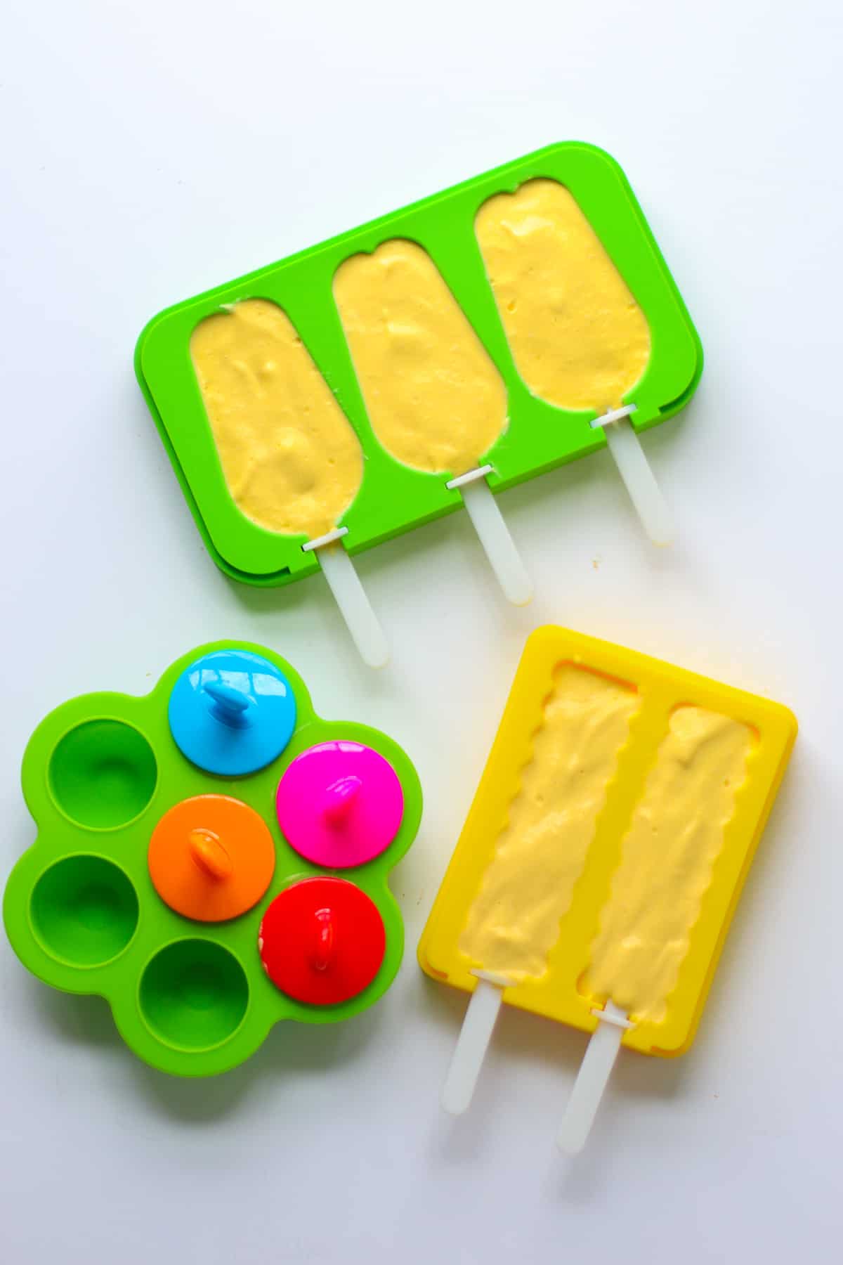 Blended mixture poured into three different popsicle molds.