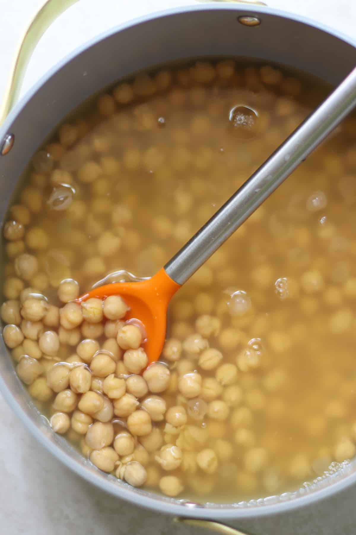 Cooked chickpeas in a large pot.