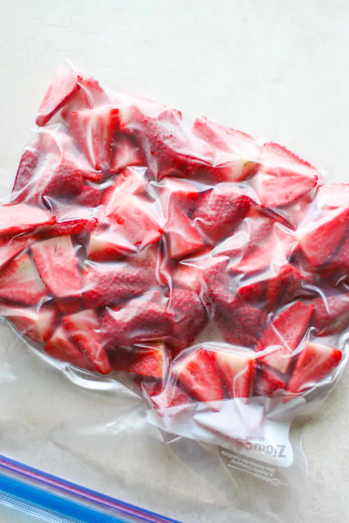 Strawberries in freezer-safe bag with air removed.