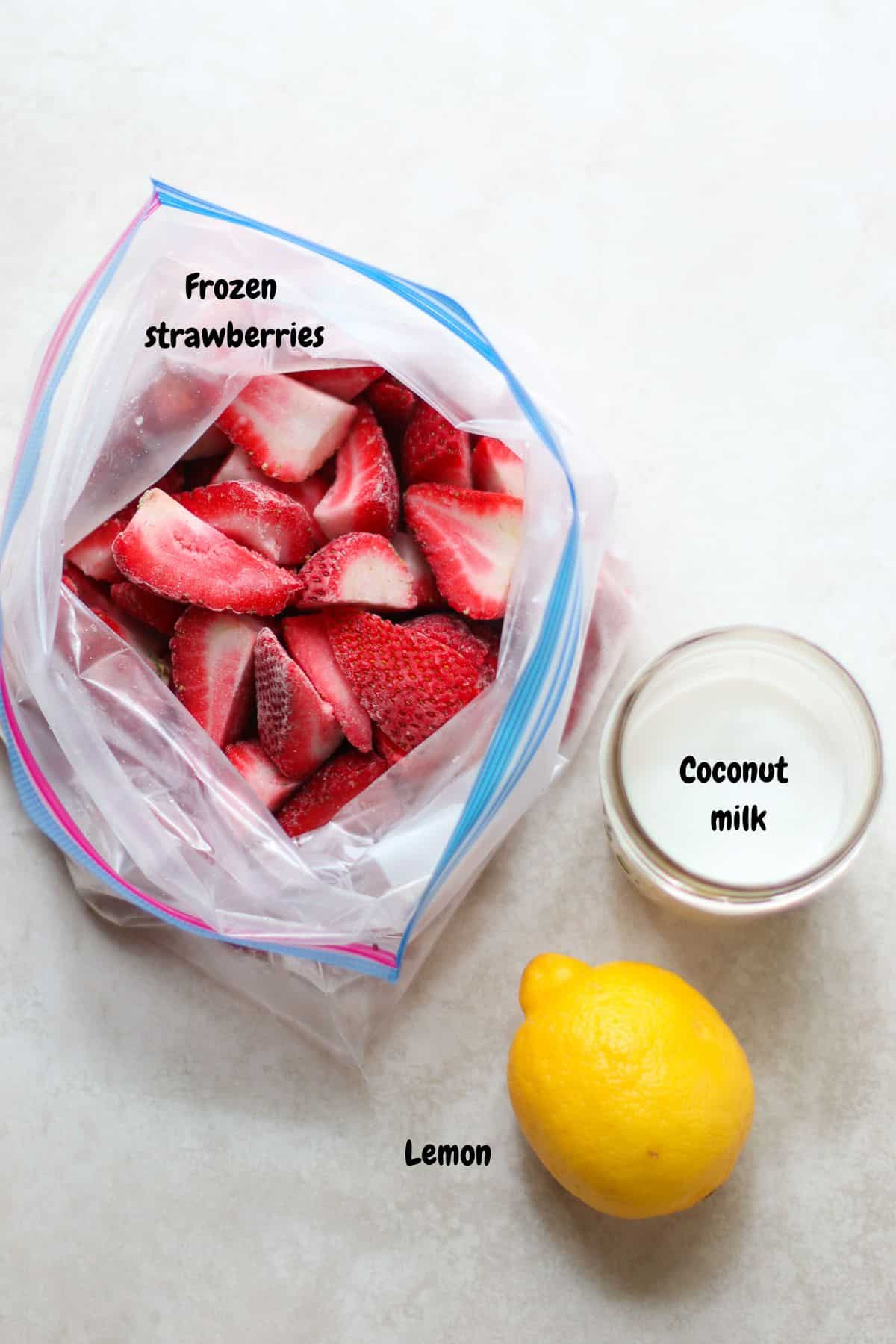 Frozen strawberries, coconut milk, and lemon.