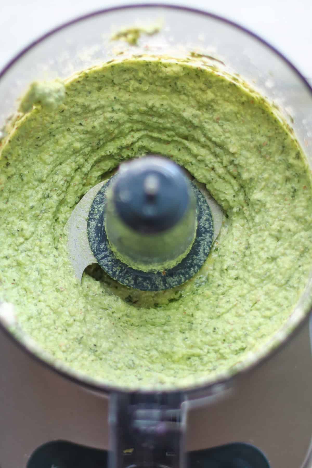 Blended ricotta pesto in a food processor.