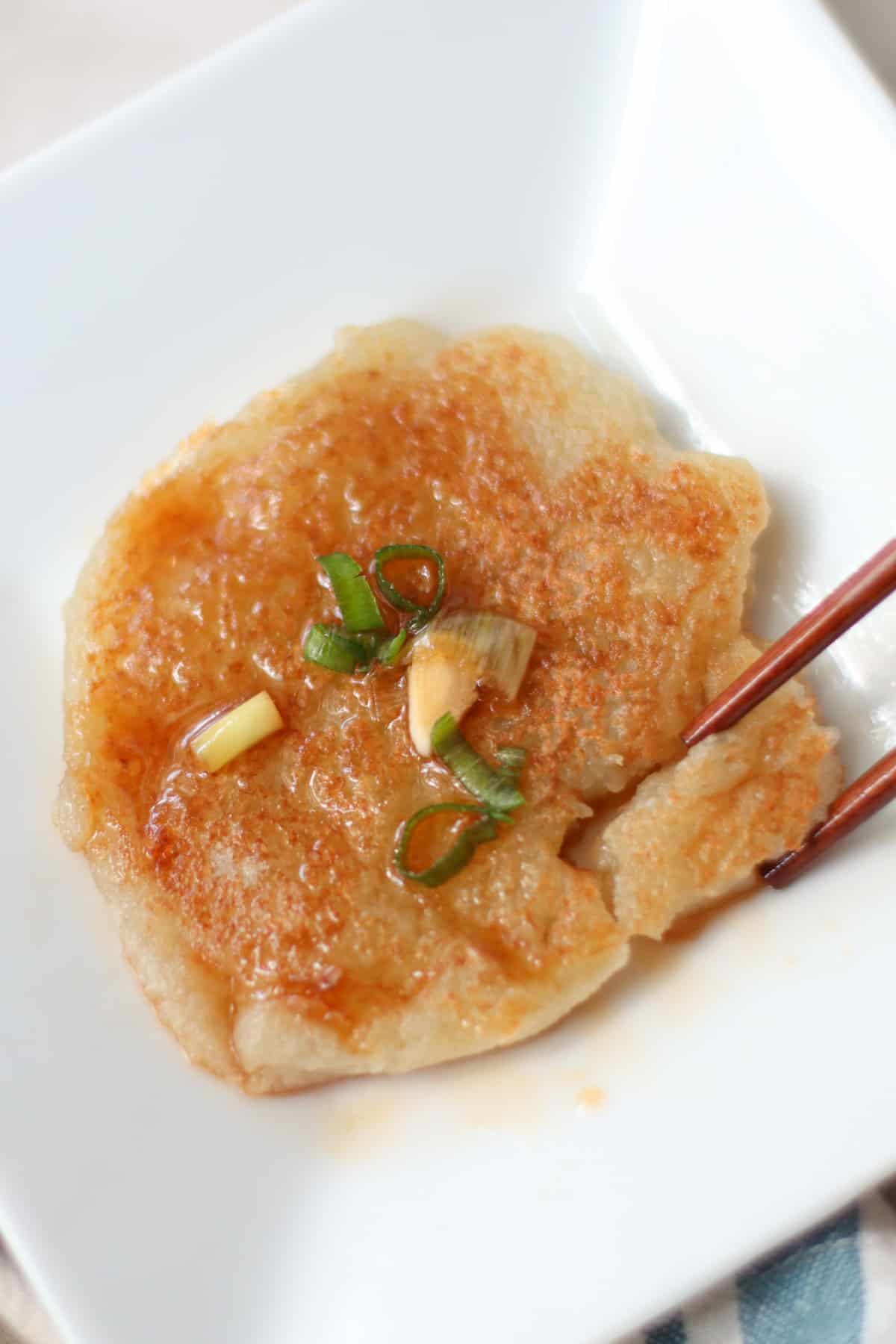 A close up shot of Korean potato pancake on a plate.