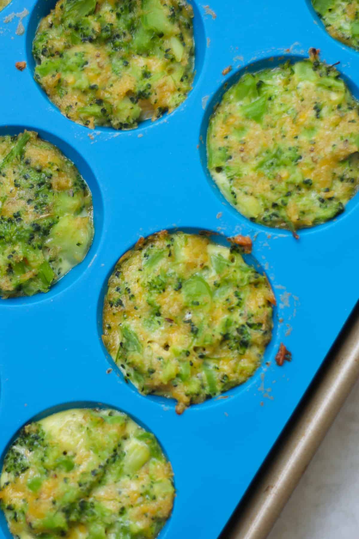 A close up shot of baked bites in silicone muffin pan.