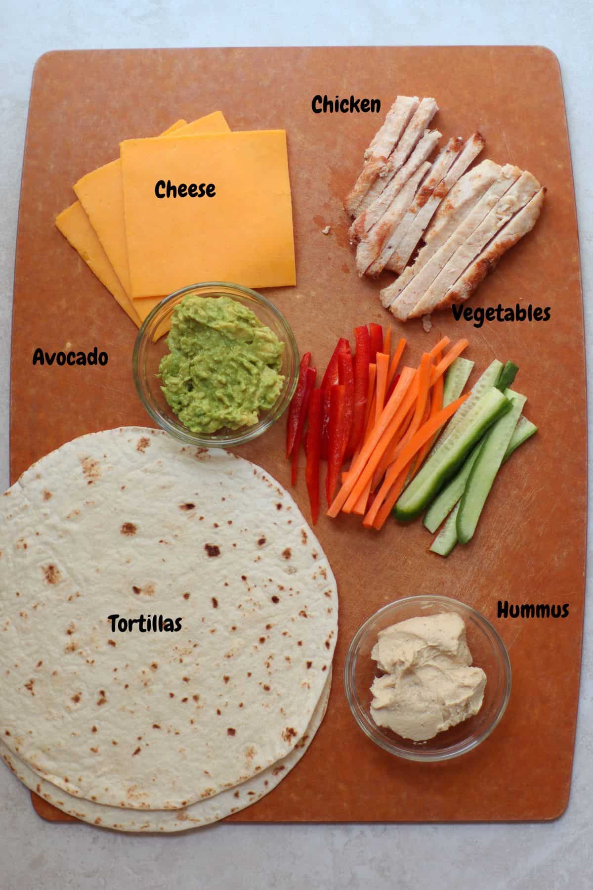 All the ingredients laid out on a wooden board.