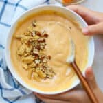 Pumpkin yogurt topped with graham crackers and pecans.