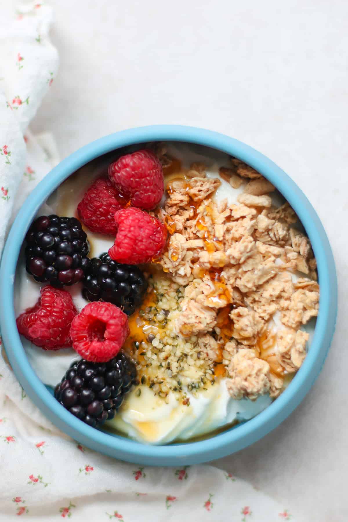 yogurt granola bowl with berries and chia seeds.