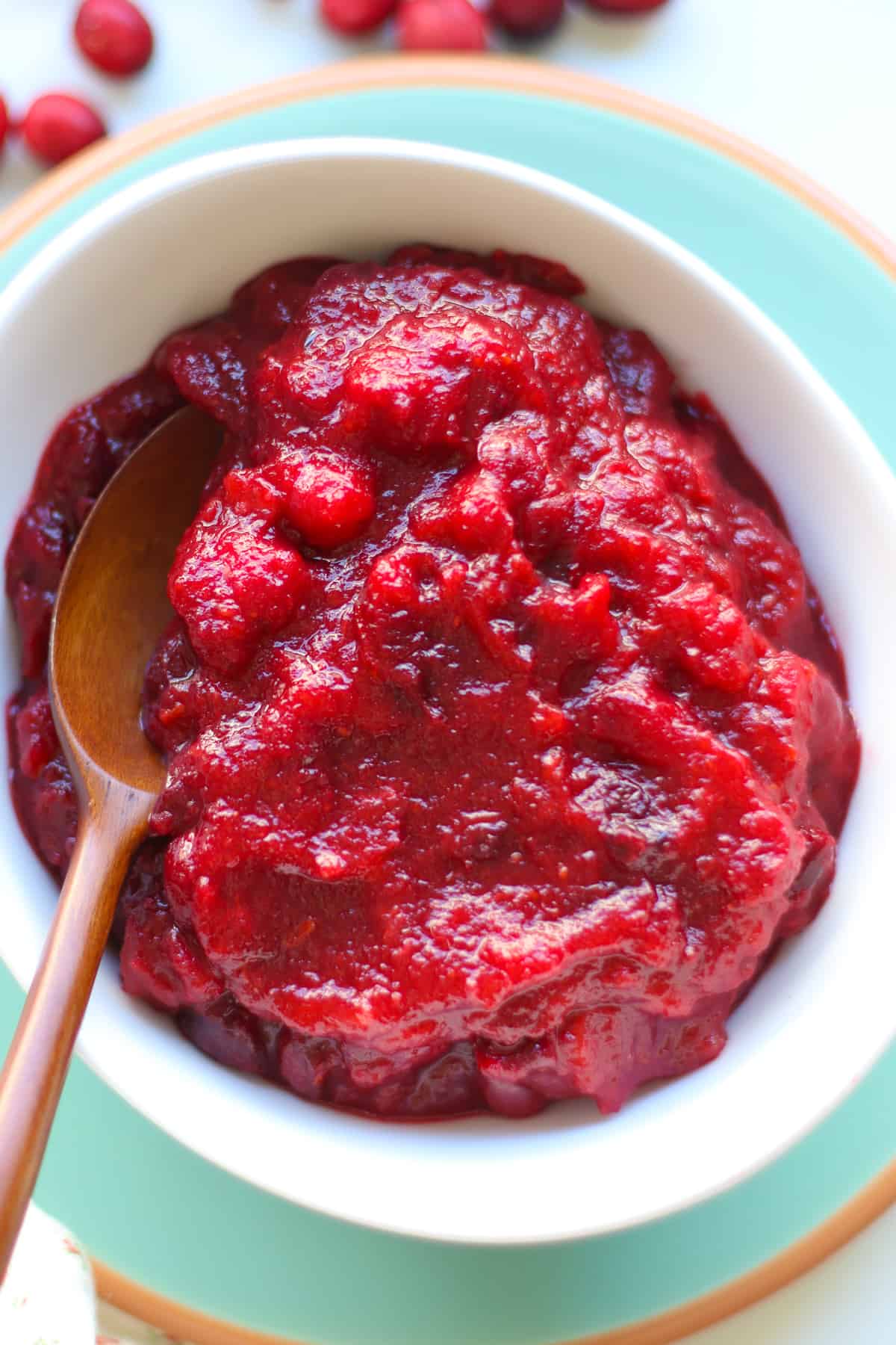 A close up shot of cranberry sauce in a white plate.