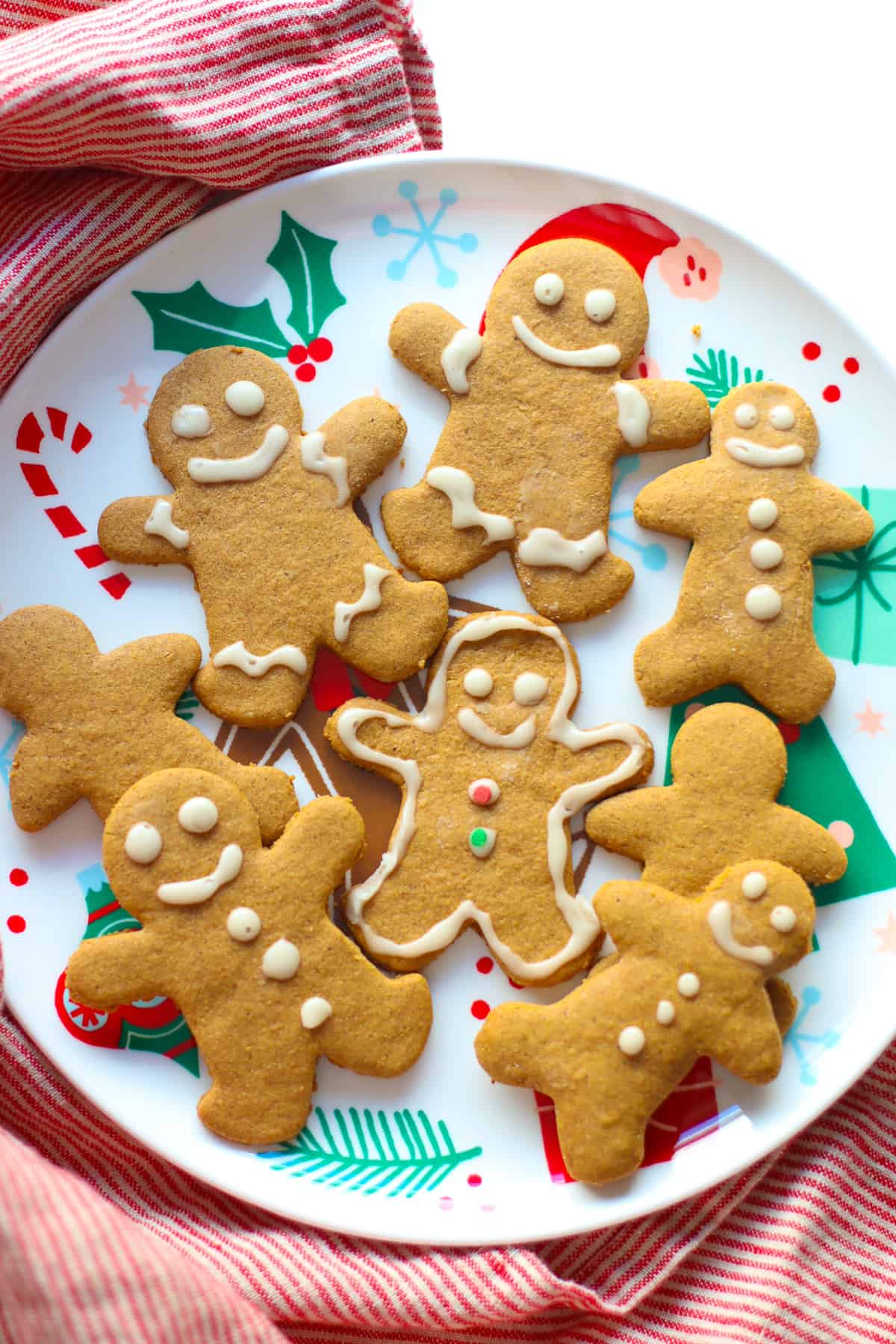 Baked and decorated gingerbread cookies on a festive plate.