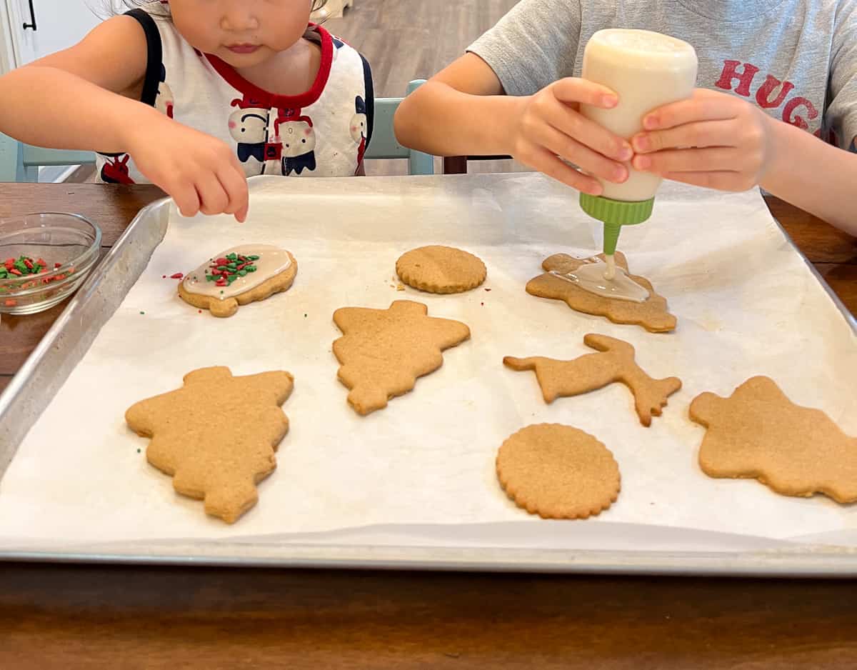Kids decorating the cookies.