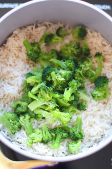 Cooked rice mixed with broccoli.