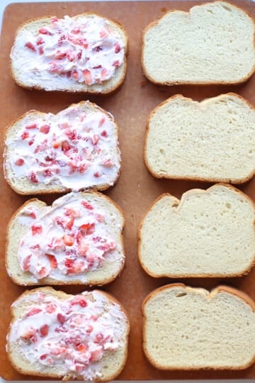 Strawberry mixture spread onto one side of the bread.