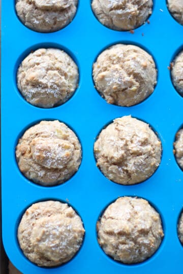 Baked muffins in a blue silicon muffin tin.