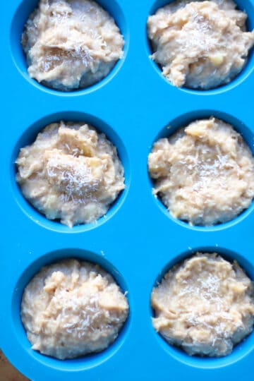 Batter divided into blue silicon muffin tin.