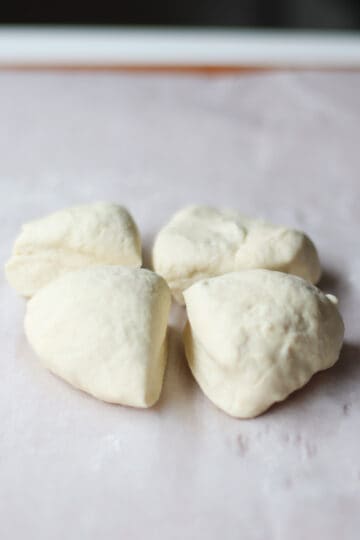Dough divided into fourths.